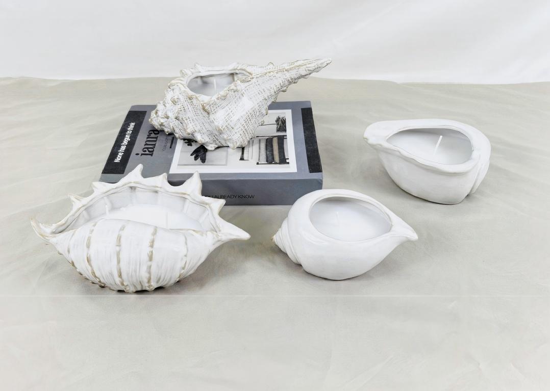 மெழுகுவர்த்தி வைத்திருப்பவர்கள் பல வடிவங்களில் வருகிறார்கள். ஒரு சீஷெல் போன்ற வடிவத்தை நீங்கள் எப்போதாவது பார்த்தீர்களா?